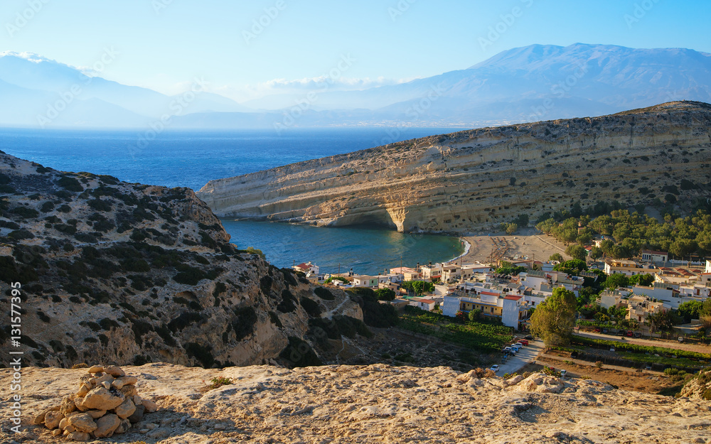 Top view of the village of Matala and caves where the hippies lived. Tourist destination on the island of Crete. Greece.