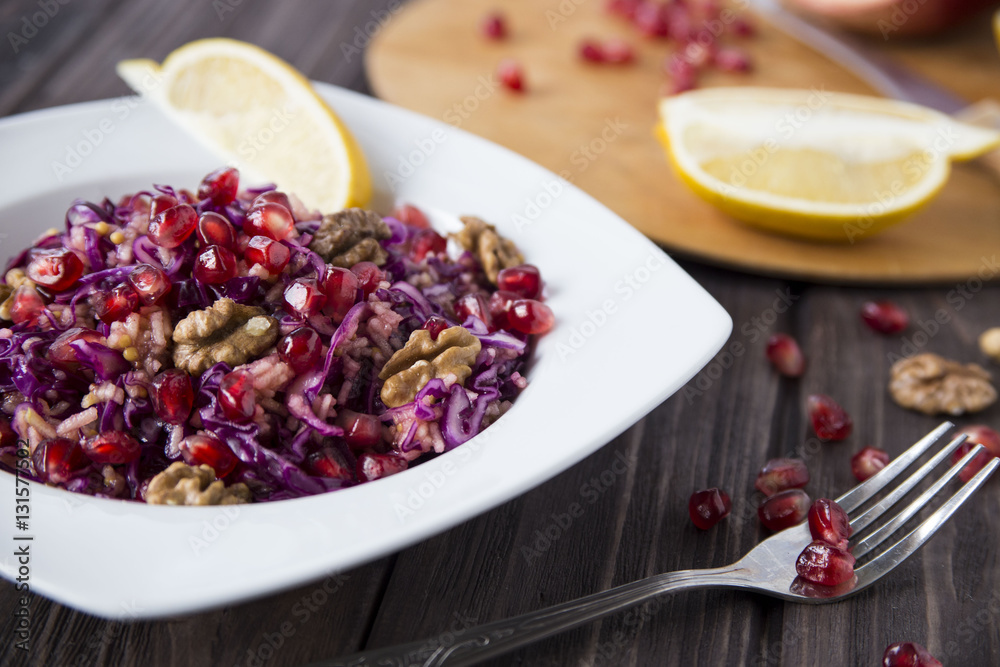 salad of red cabbage, pomegranate, apple and walnuts salad of red cabbage, pomegranate, apple and walnuts