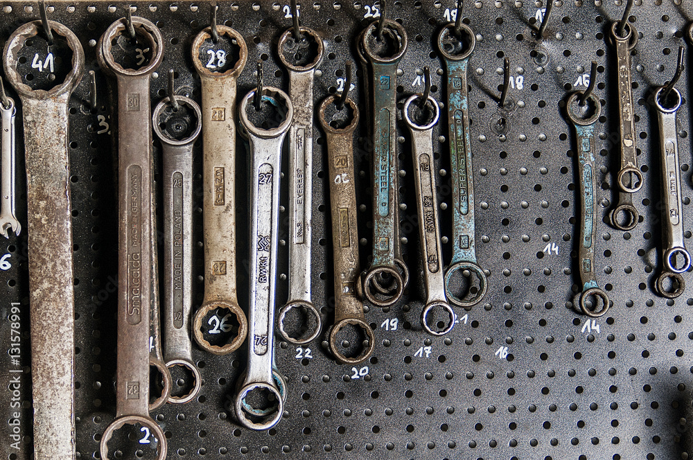 Wrenches hanging on the wall in garage StockFoto Adobe Stock