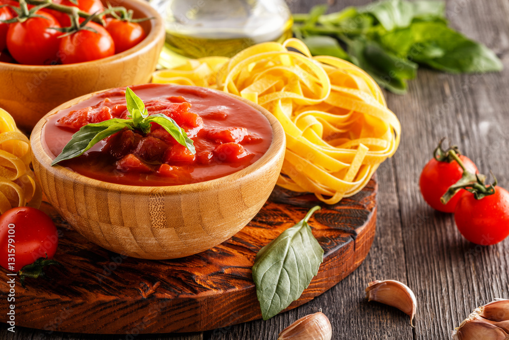 Products for cooking - tomato sauce, pasta, tomatoes, garlic. Products for cooking - tomato sauce, pasta, tomatoes, garlic.