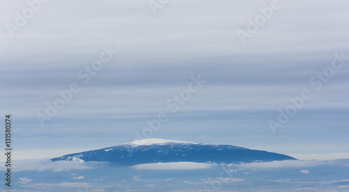 Snowy Peak over the clouds
