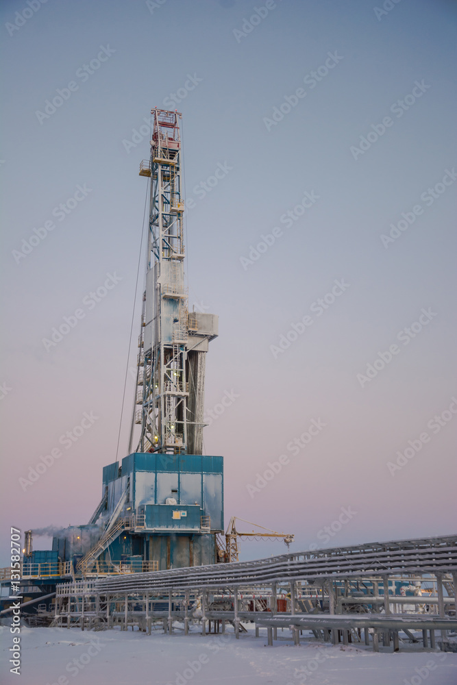 In the northern oil and gas field. Drilling rig. Before her lay the drill pipes. In the northern oil and gas field. Drilling rig. Before her lay the drill pipes.