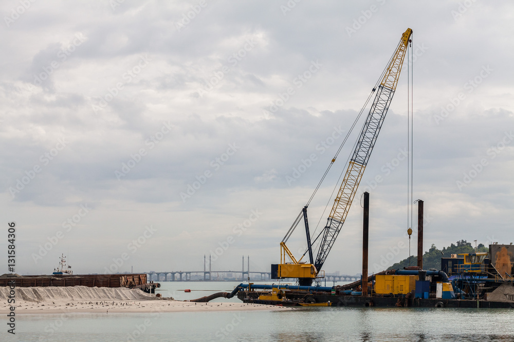 Sand replenishment ship on shore for land reclamation Sand replenishment ship on shore for land reclamation