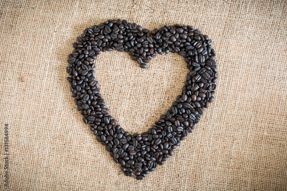 Coffee beans arranged in a heart shape Coffee beans arranged in a heart shape