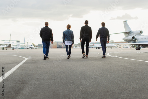 Valokuva Young men walking on airfield