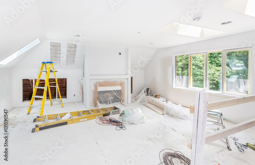 One skylight installed with interior cutouts finished on two more. Fireplace and cabinet cutouts complete