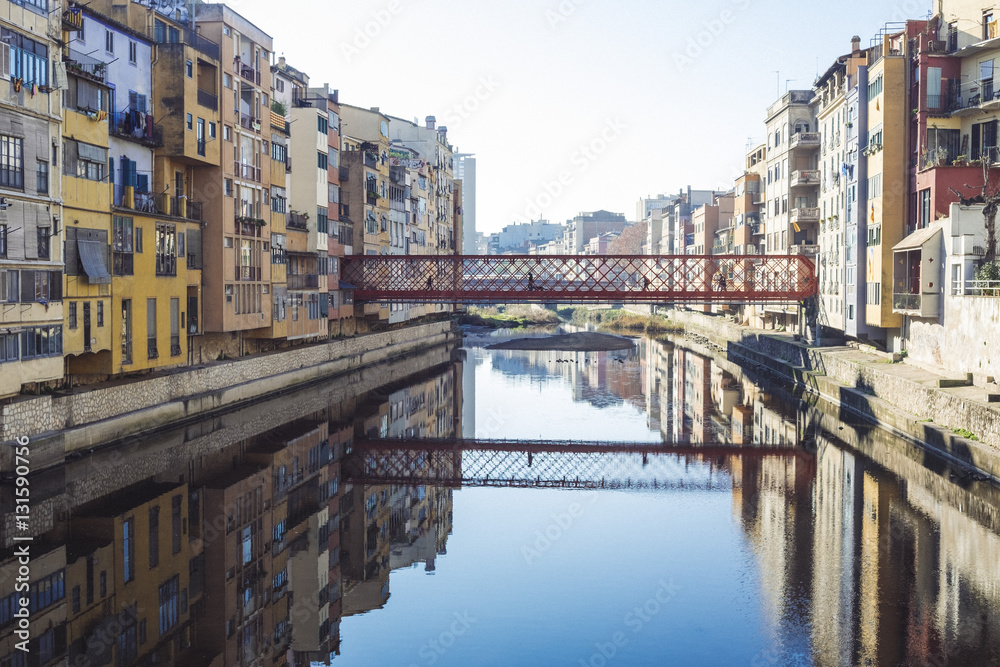River reflection houses and bridges famous landmark in Girona