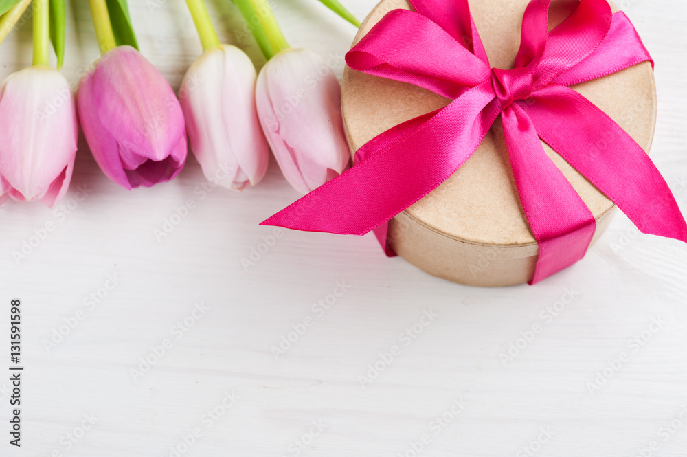 Red pink yellow tulips and gift box with red ribbon