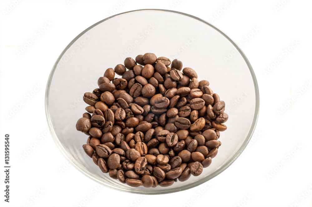 Roasted coffee beans on a glass transparent plate, isolated on white background.