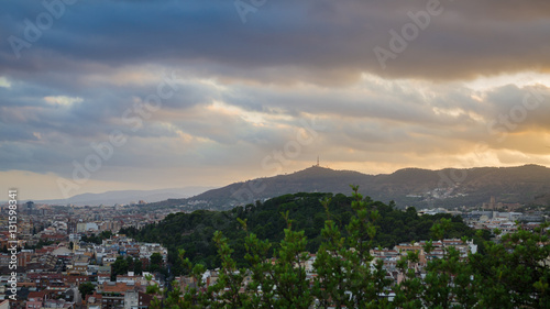 Blue yellow clouds on hills near Barcelona, Spain