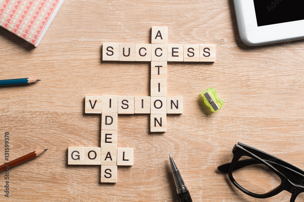 Conceptual business keywords on table with elements of game making crossword Conceptual business keywords on table with elements of game making crossword