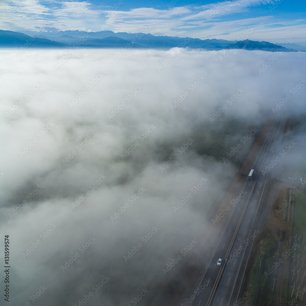 road bird's eye view over the clouds 02