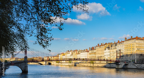 The Saône River and a pedestrian bridge in Lyon, France, Europe photo