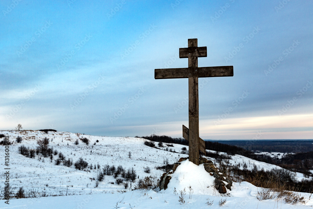 cross on hill in winter cross on hill in winter
