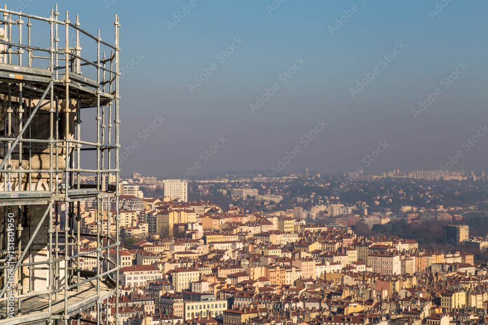 Scaffolding above a city with a clear sky