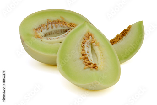 sliced honeydew melon isolated on white background
