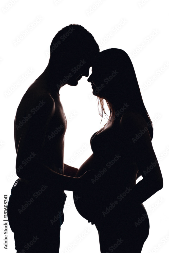 Young pregnant couple expecting. silhouette, white isolated. Pre