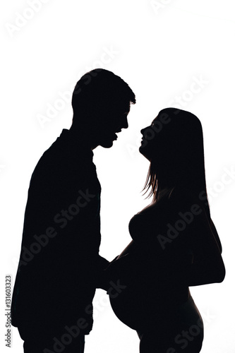 Young pregnant couple expecting. silhouette, white isolated. Pre