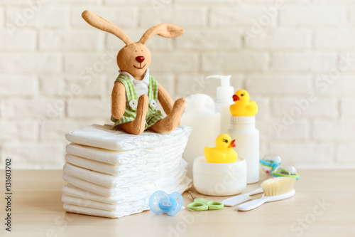 Fototapeta Naklejka Na Ścianę i Meble -  Set of baby accessories for hygiene on wooden table closeup