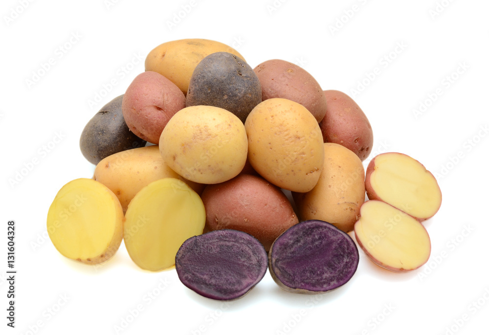 Mixed varieties of potatoes: red potatoes, yellow potatoes and purple potatoes Mixed varieties of potatoes: red potatoes, yellow potatoes and purple potatoes