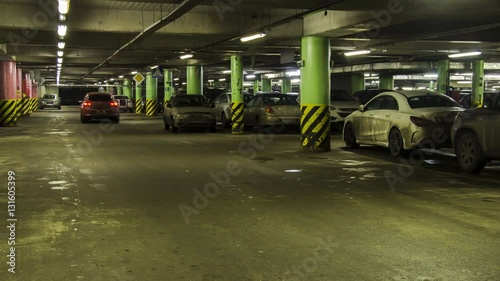 motion in underground parking of hypermarket ,shopping mall ,time lapse
