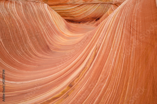Red Sandstone Wave - Rolling red sandstone rock waves at The Wave, a dramatic and colorful erosional sandstone rock formation located in North Coyote Buttes area at Arizona-Utah border. 