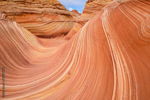 Close-up view of the colorful sandstone surfaces of The Wave, a dramatic erosional sandstone rock formation located in North Coyote Buttes area at the Arizona-Utah border. 