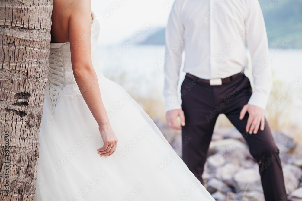 bride and groom holding hands together