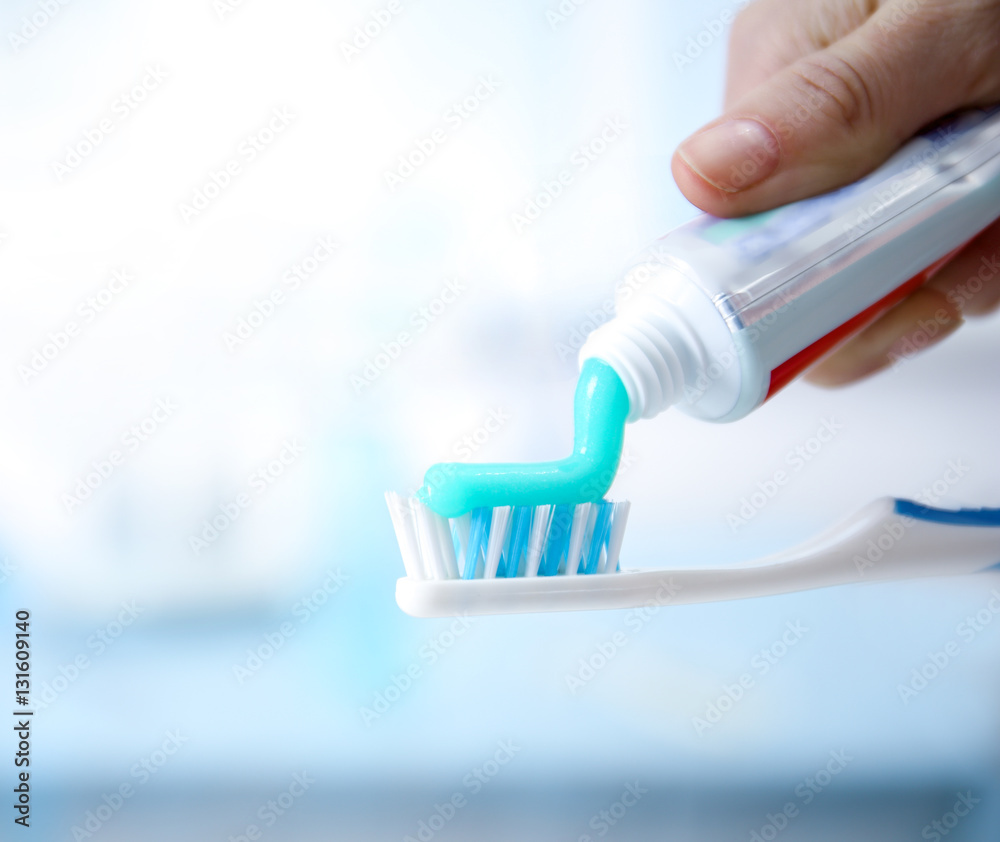 Toothbrush and toothpaste on blurred background Stock-Foto | Adobe Stock