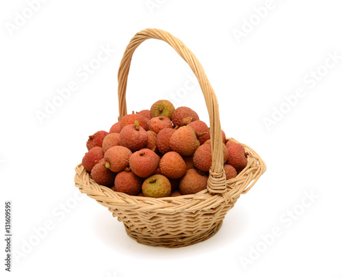 Fresh lychees fruit in basket isolated on white background
