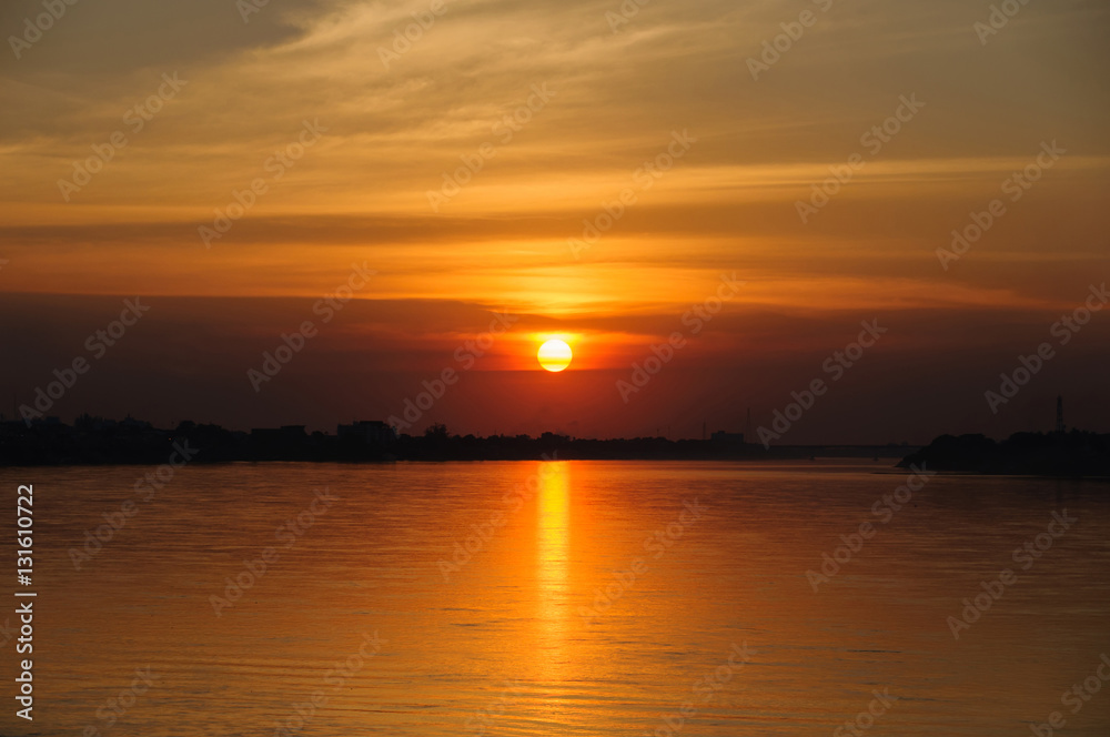 Sunset on the river sides of Thailand and Laos. The photo was taken from Thailand side in the evening.