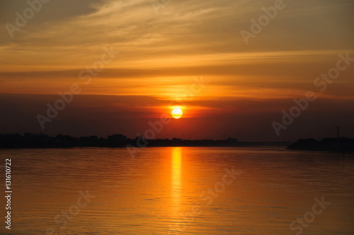 Sunset on the river sides of Thailand and Laos. The photo was taken from Thailand side in the evening.