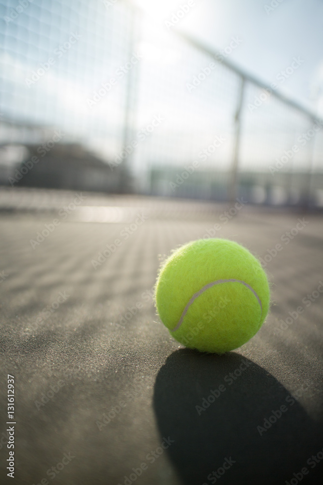 Tennis ball on hard court