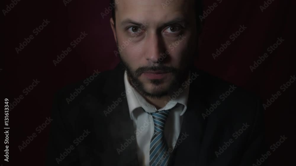 4k Shot of a Handsome Young Businessman Exhaling Angry Smoke from Nose 4k Shot of a Handsome Young Businessman Exhaling Angry Smoke from Nose