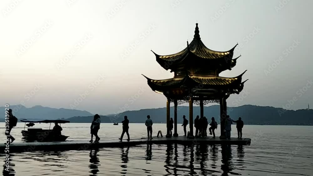 ancient pavilion in famou West Lake at twilight ancient pavilion in famou West Lake at twilight