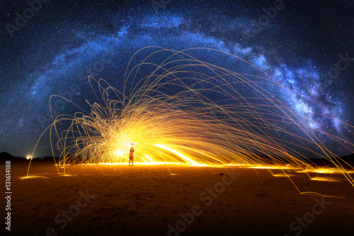 Arched Milky Way and Fiery Sparks on desert lake bed photo