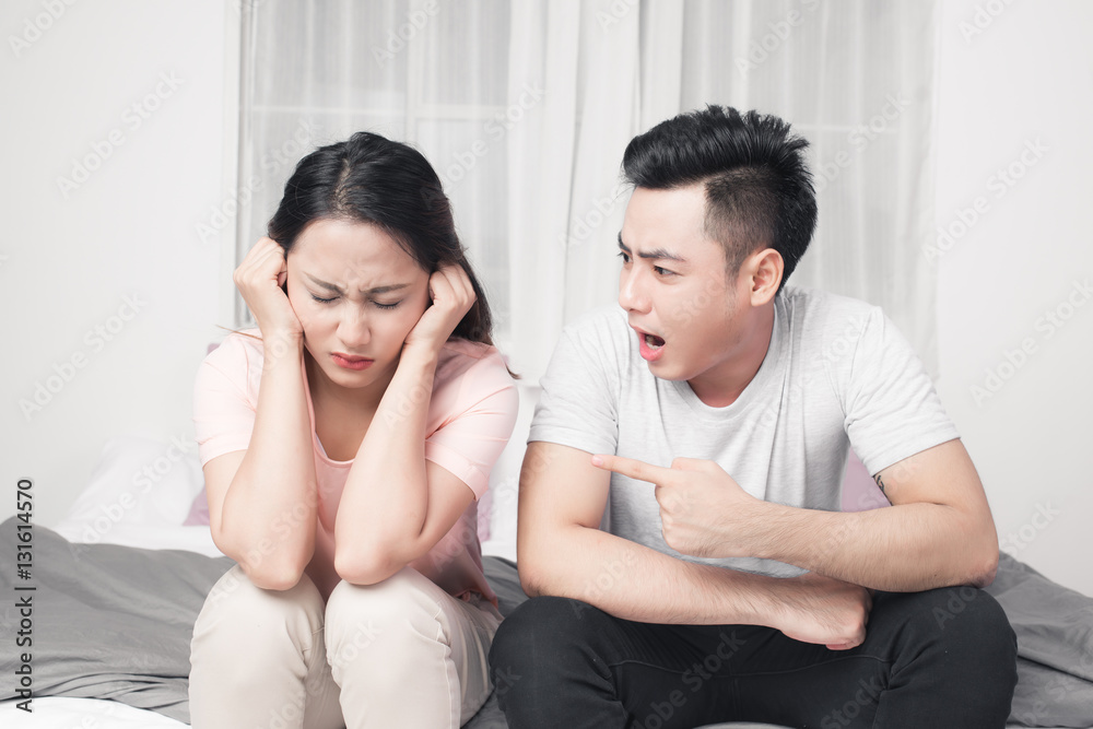 Young asian couple mad at each other in their home Young asian couple mad at each other in their home