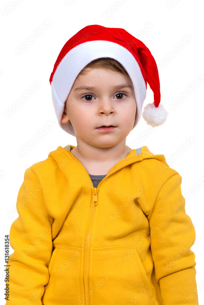 little boy wearing on red Santa helper hat. Isolated over white background. little boy wearing on red Santa helper hat. Isolated over white background.