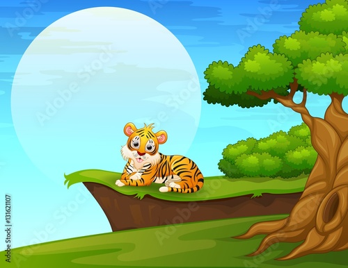 Fototapeta Naklejka Na Ścianę i Meble -  Cartoon tiger lay down near the cliff