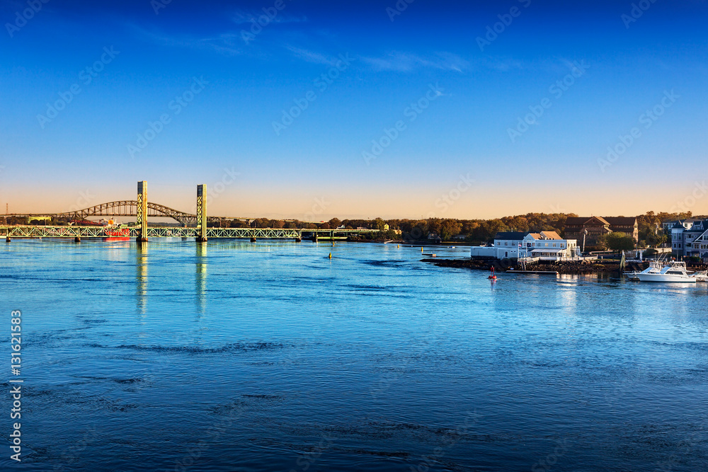 Morning sun hits the Piscataqua River and Sarah M. Long Bridges, connecting Portsmouth, New Hampshire and Maine