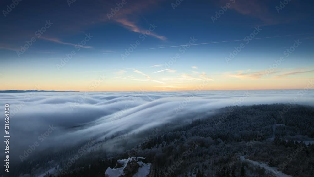 Time-lapse of beautiful sunrise in cloudy mountains at winter Time-lapse of beautiful sunrise in cloudy mountains at winter