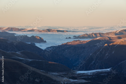 The formation and movement of clouds above the volcano Elbrus in the Caucasus Mountains in winter.