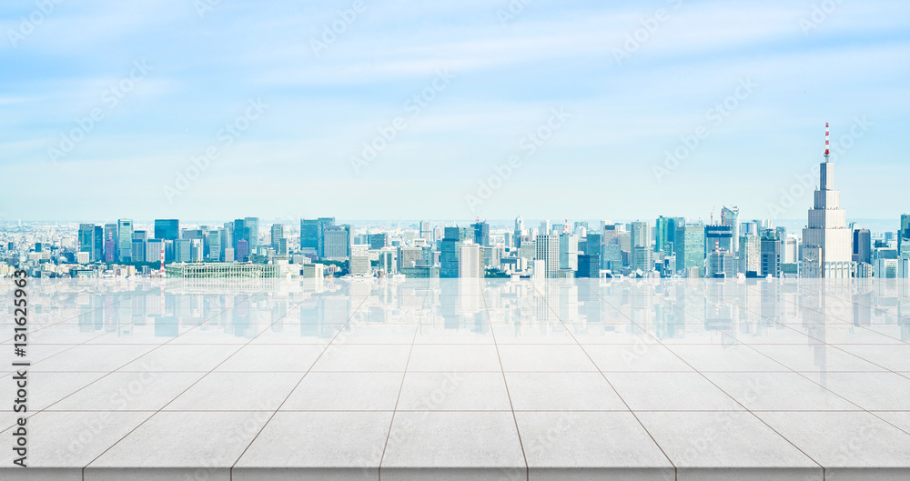 Business concept - Empty concrete floor top with panoramic modern cityscape building bird eye aerial view under sunrise and morning blue bright sky of Tokyo, Japan for display or montage product