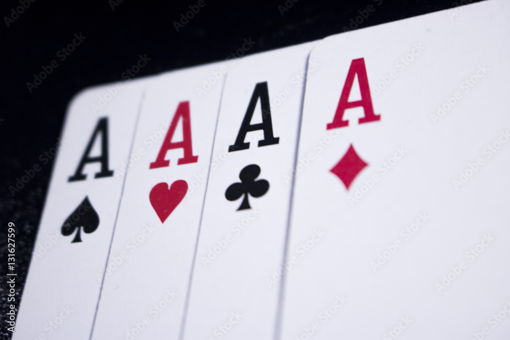 Obraz premium ace four of a kind poker card on dark black background