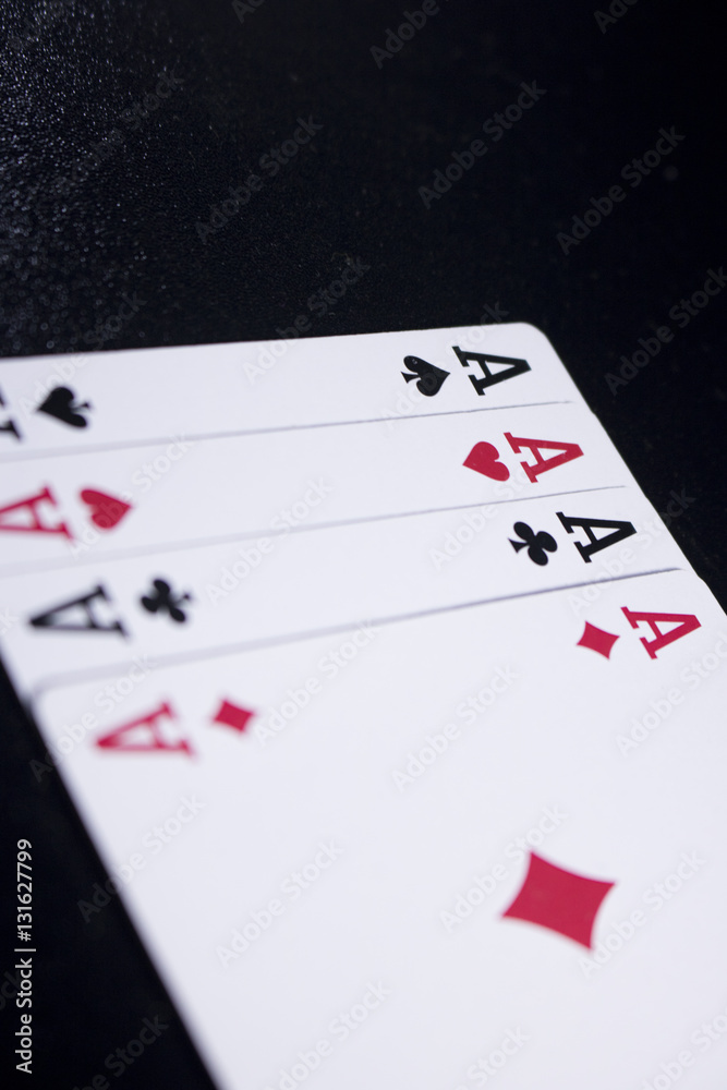ace four of a kind poker card on dark black background ace four of a kind poker card on dark black background