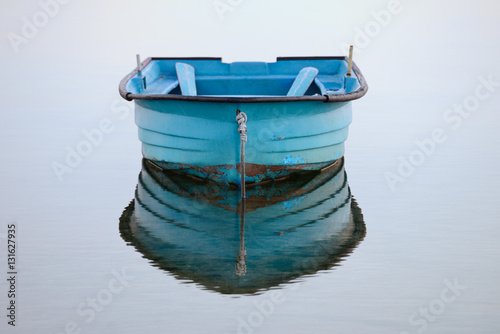 wooden fishing boat on a background of water