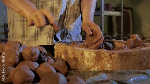 Pottery workshop, manufacture of ceramic ware, clay balls photo