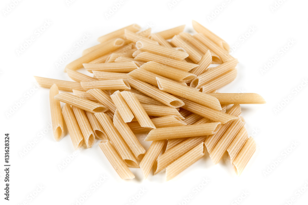 Brown rice penne isolated on a white background Brown rice penne isolated on a white background
