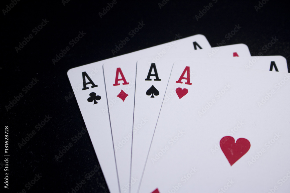 Obraz premium ace four of a kind poker card on dark black background