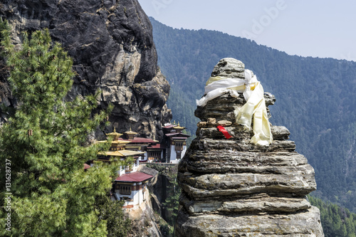 View Point of Taktshang monastery, Bhutan - Tigers Nest Monastery also know as Taktsang Palphug Monastery. This image is purposely blurred out the blackgroud to bring focus on the prayer stone. photo